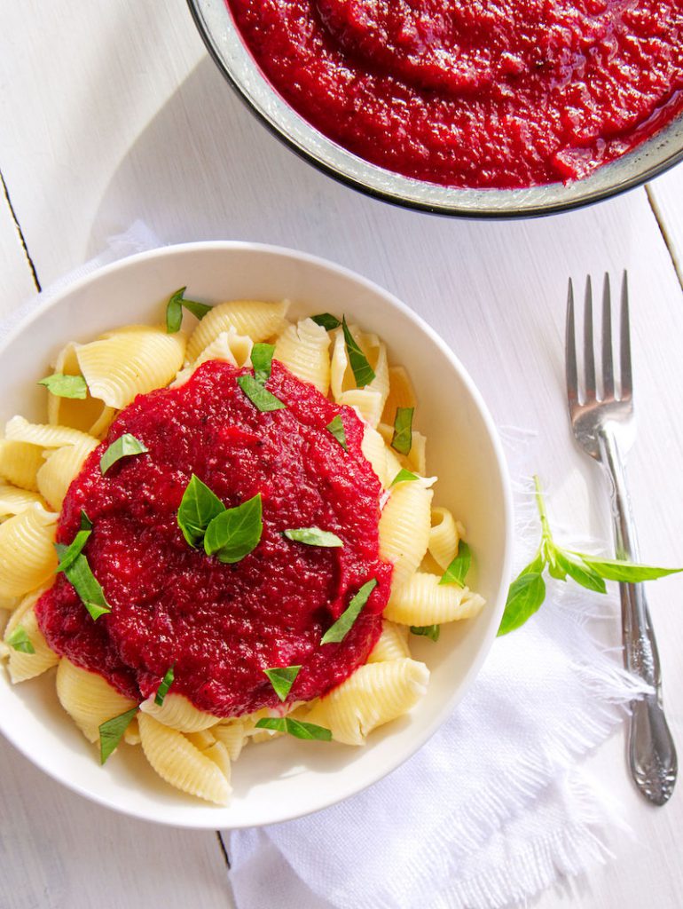 Red Beauty Vegetable Sauce spooned over cooked shell pasta. 