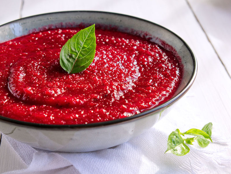 Bowl of red vegetable sauce made from nightshade-free ingredients. 